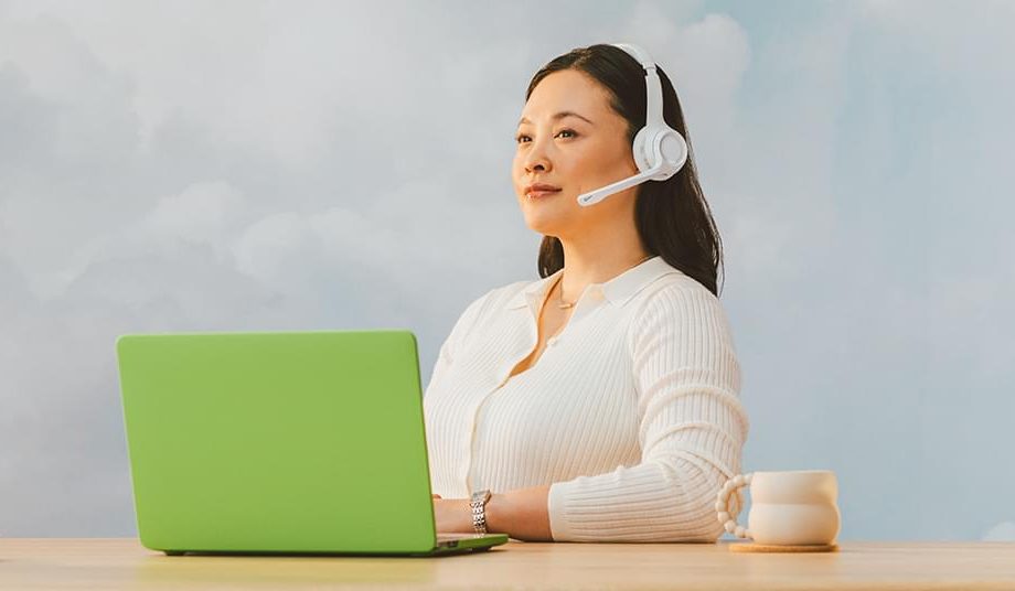 heroimageofcallcentercustomerservicerepresentativesitsinfrontofalaptop