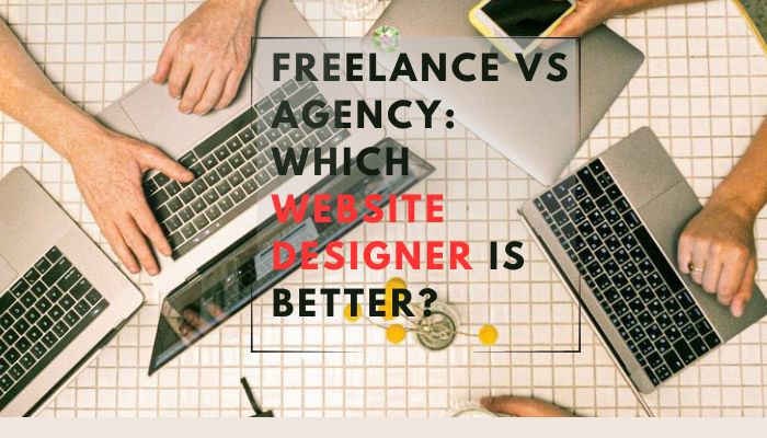 Top view of people working on laptops around a table, representing the comparison between freelance and agency website designers.